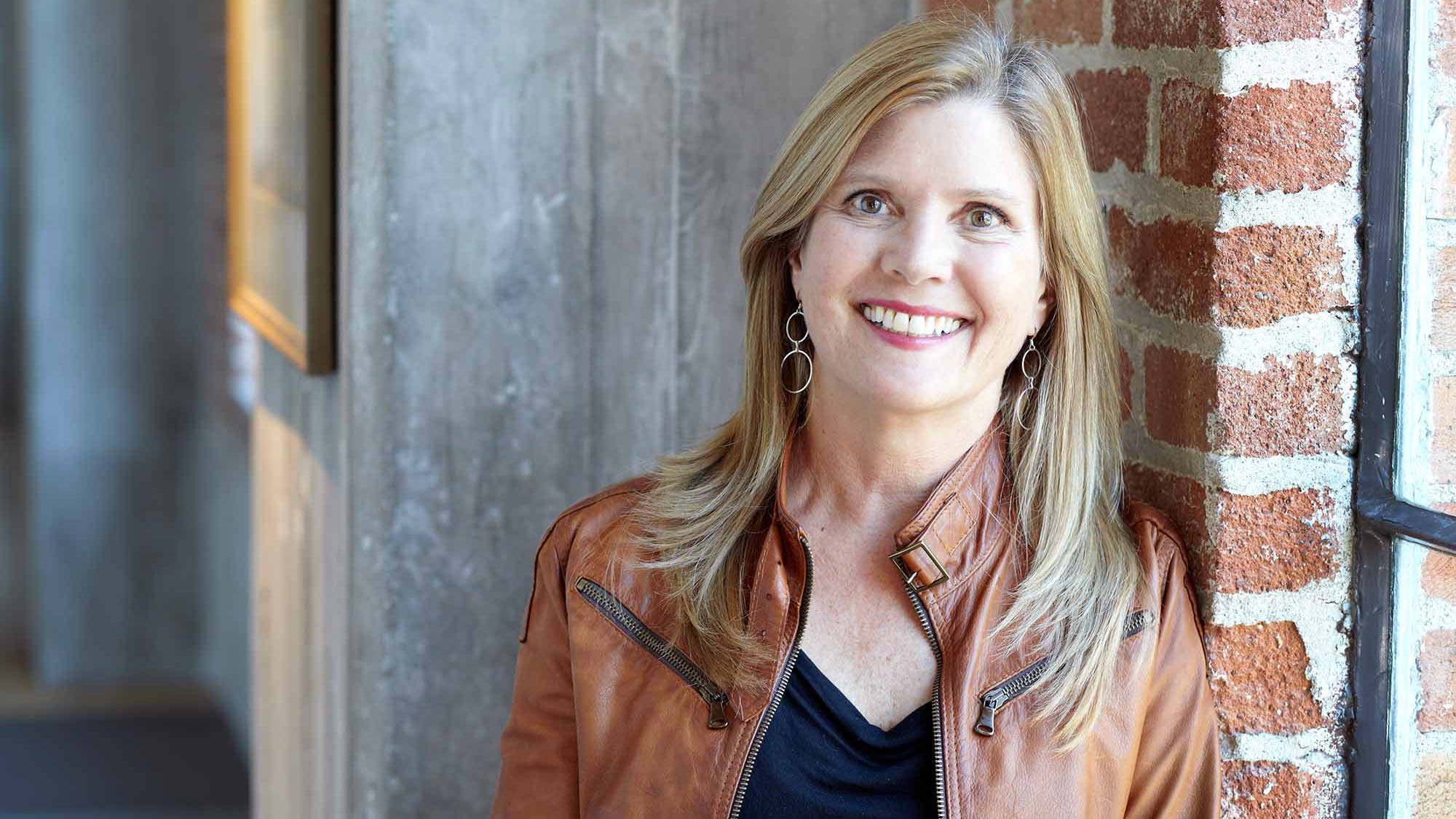 A woman smiling for the camera.