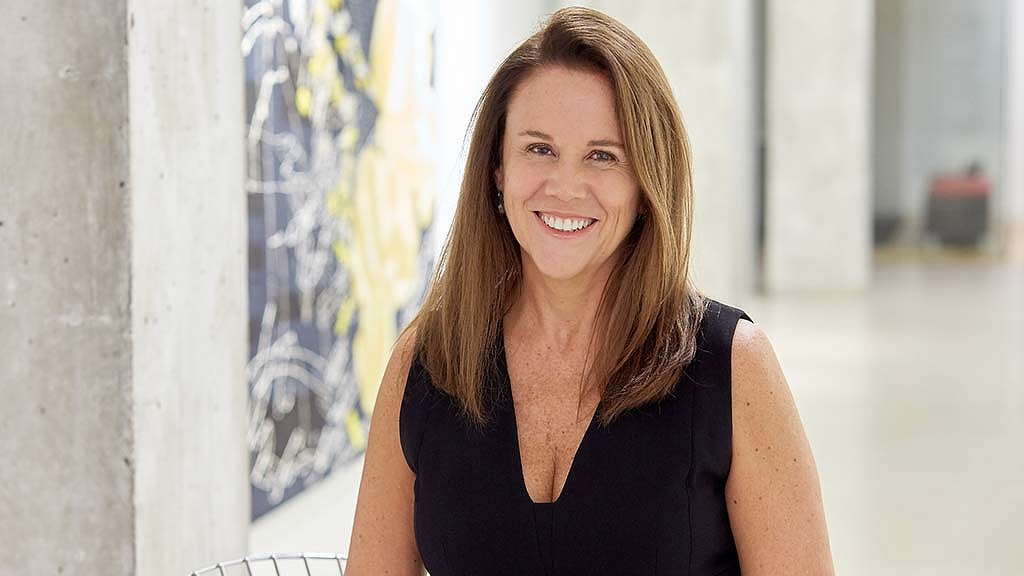 A woman smiling at the camera.