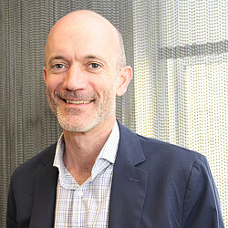 A man smiling for the camera.