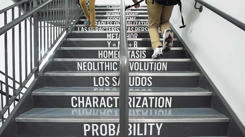 A person walking up a flight of stairs.