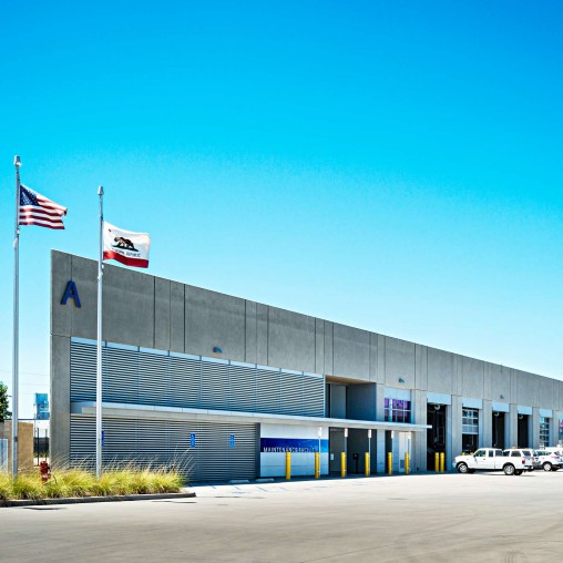 A building with flags in front of it.