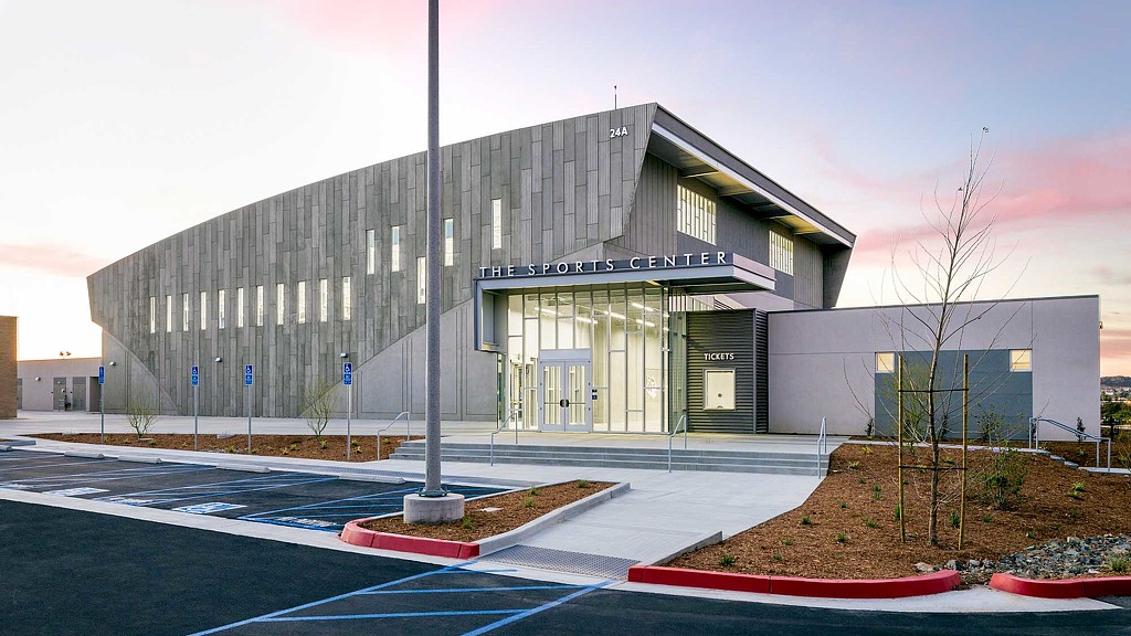 A building with a parking lot.