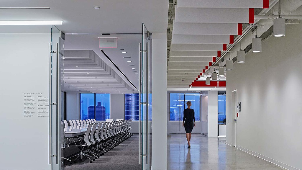 A person walking in a hallway.