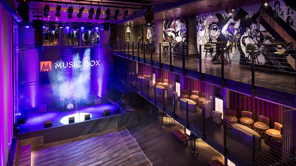 A stage with a large screen.