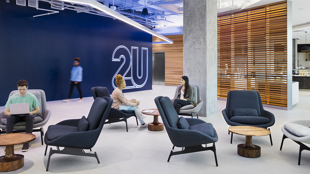 People sitting in chairs in a room.