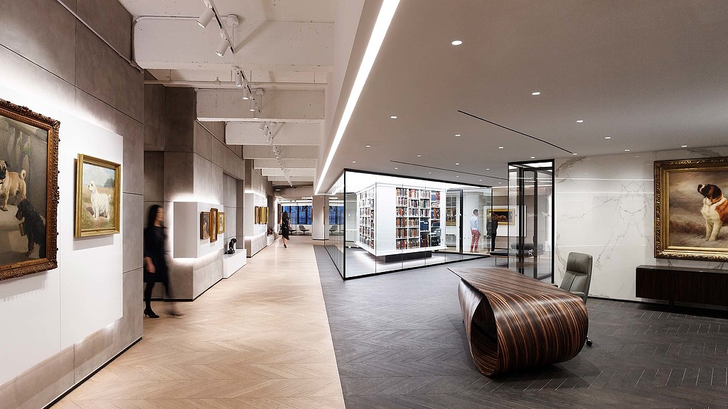 A large room with art on the walls.