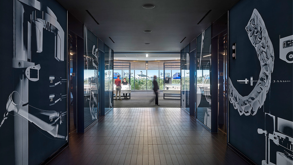 A long hallway with glass doors.