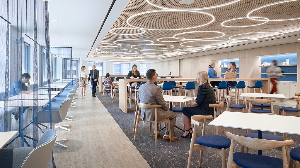 People sitting at tables in a room.