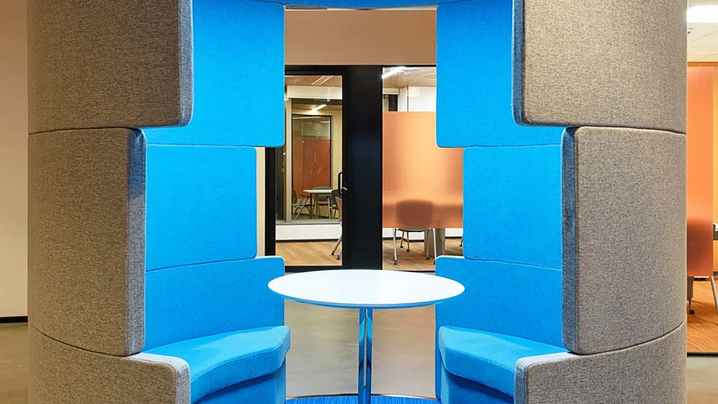 A room with a table and chairs.