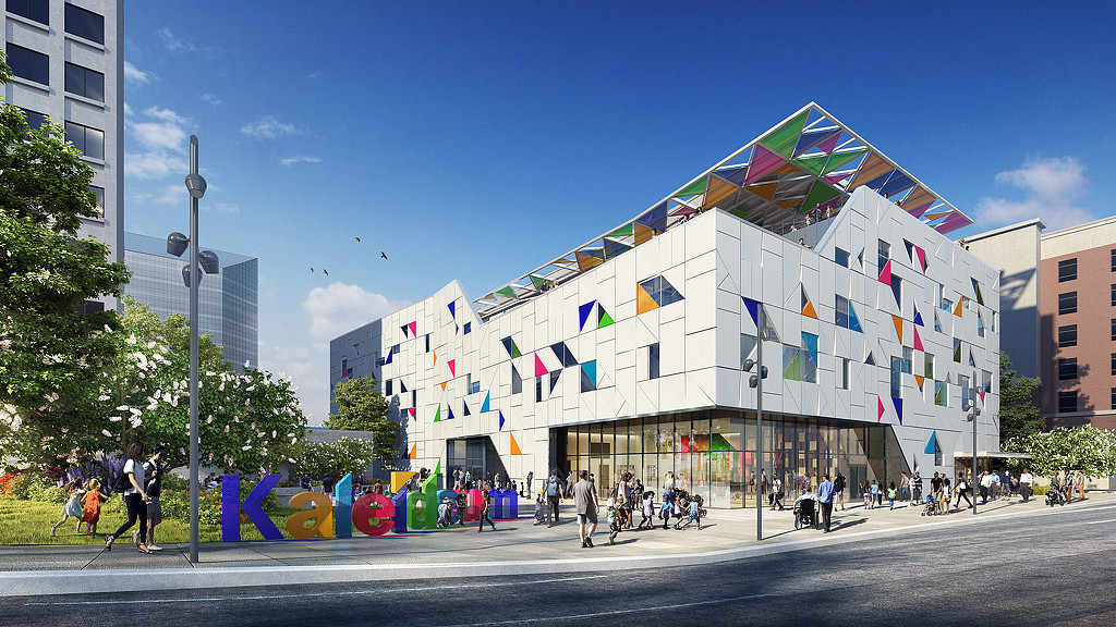 A building with flags on the roof.