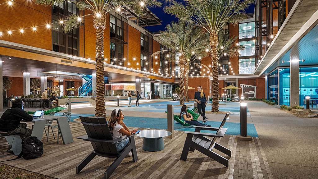 People sitting on benches outside.