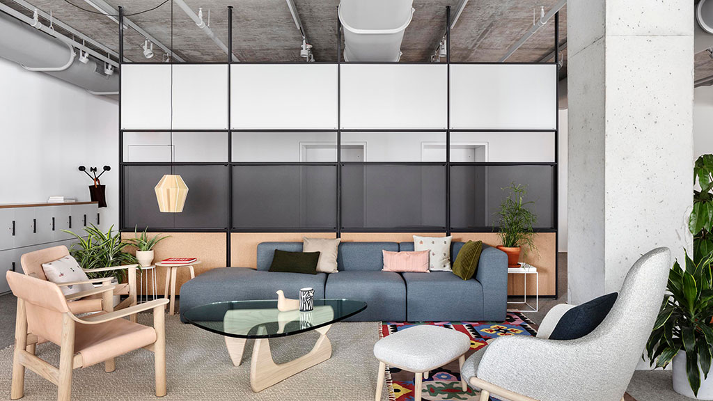 A living room with a couch and chairs.