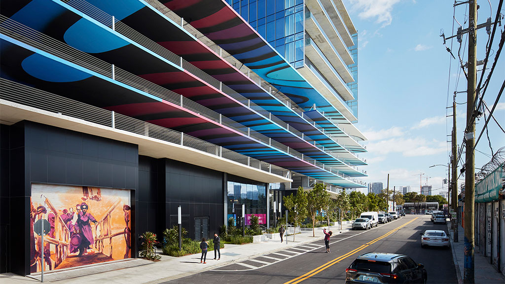 A building with a street and cars.
