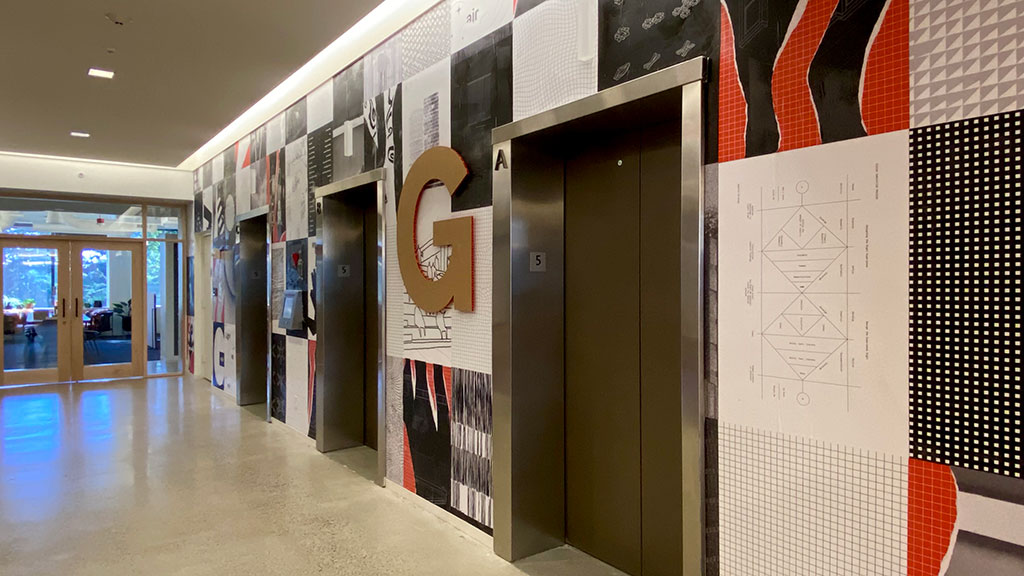 A hallway with a sign on the wall.