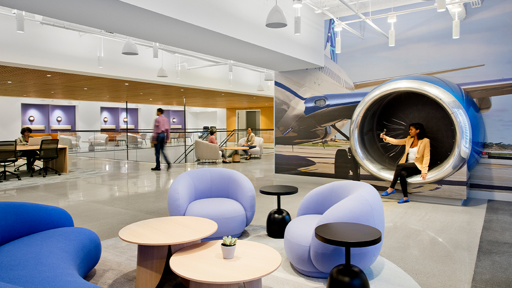 The United Airlines Amenity Hub in Chicago, with a plush seating area and decorative turbine