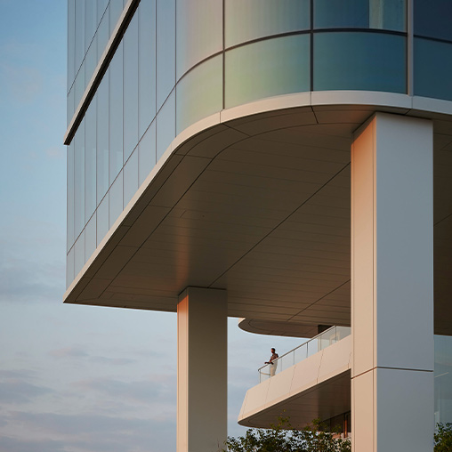 A person standing on the edge of a balcony at 1229 W Concord in Lincoln Yards