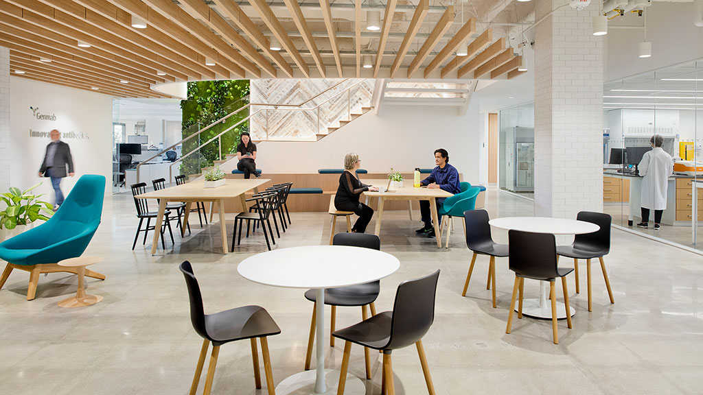 A group of people sitting at tables.