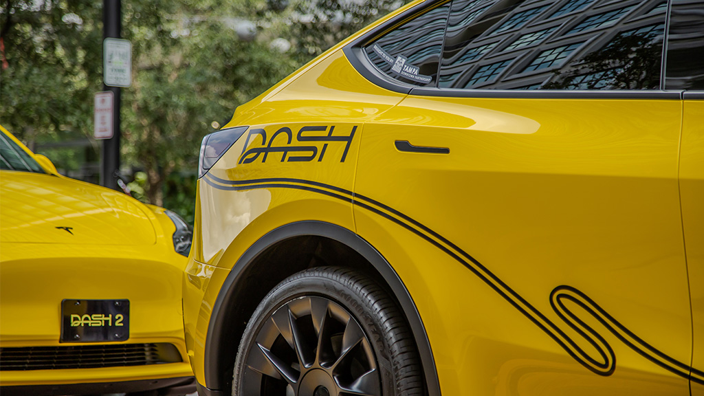 DASH branding on yellow Teslas