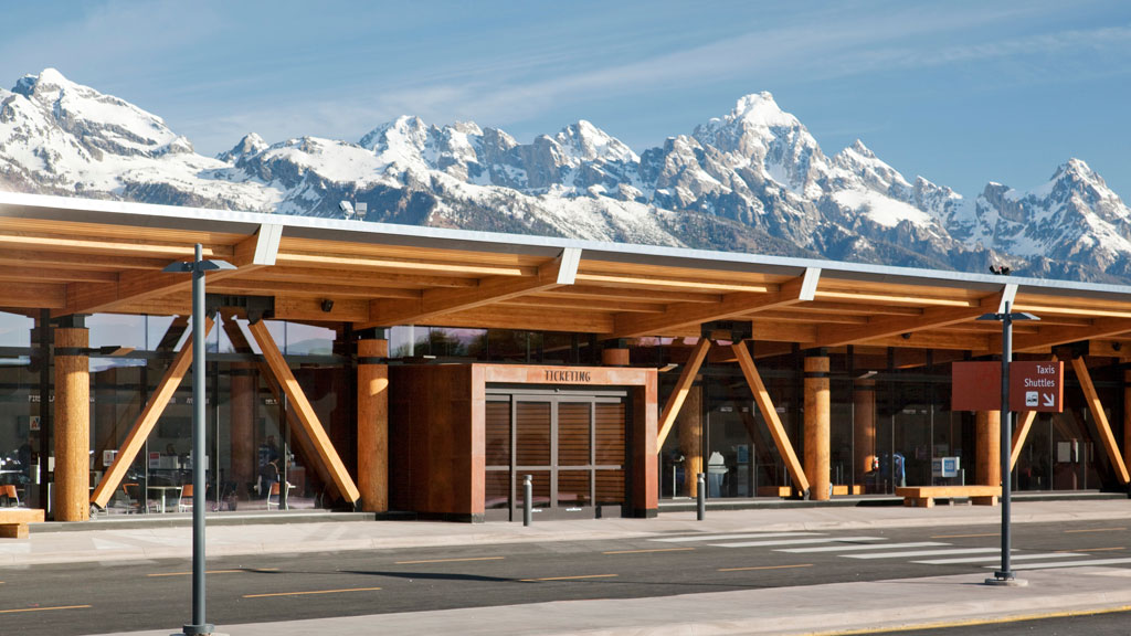 A building with mountains in the background.