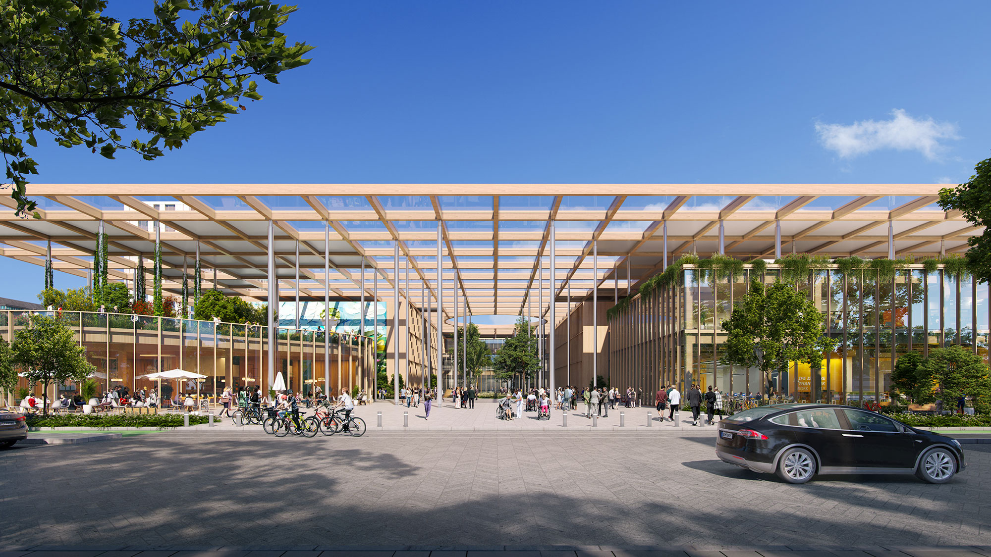 A large building with many bikes parked outside.