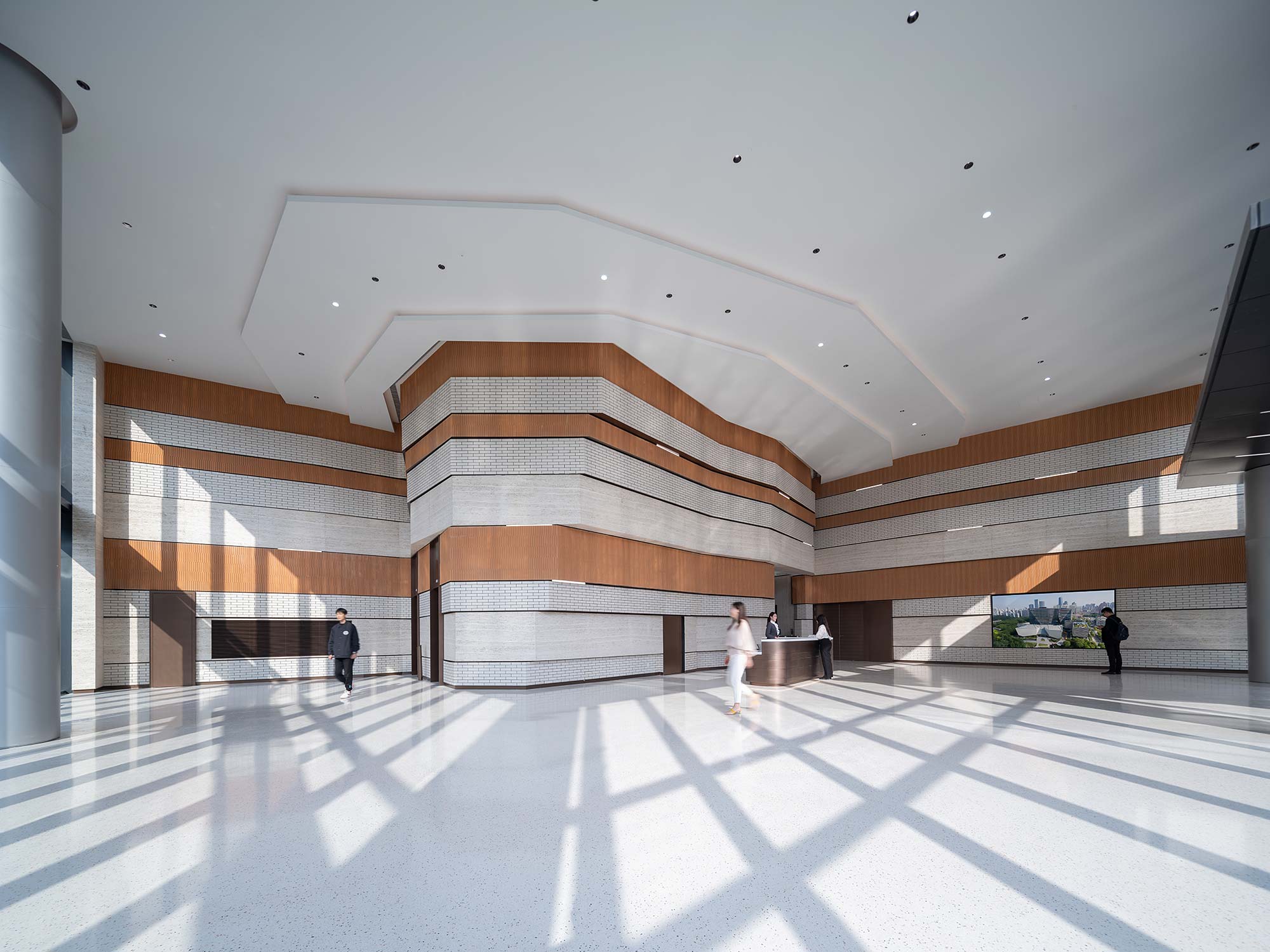 A large building with a few people.