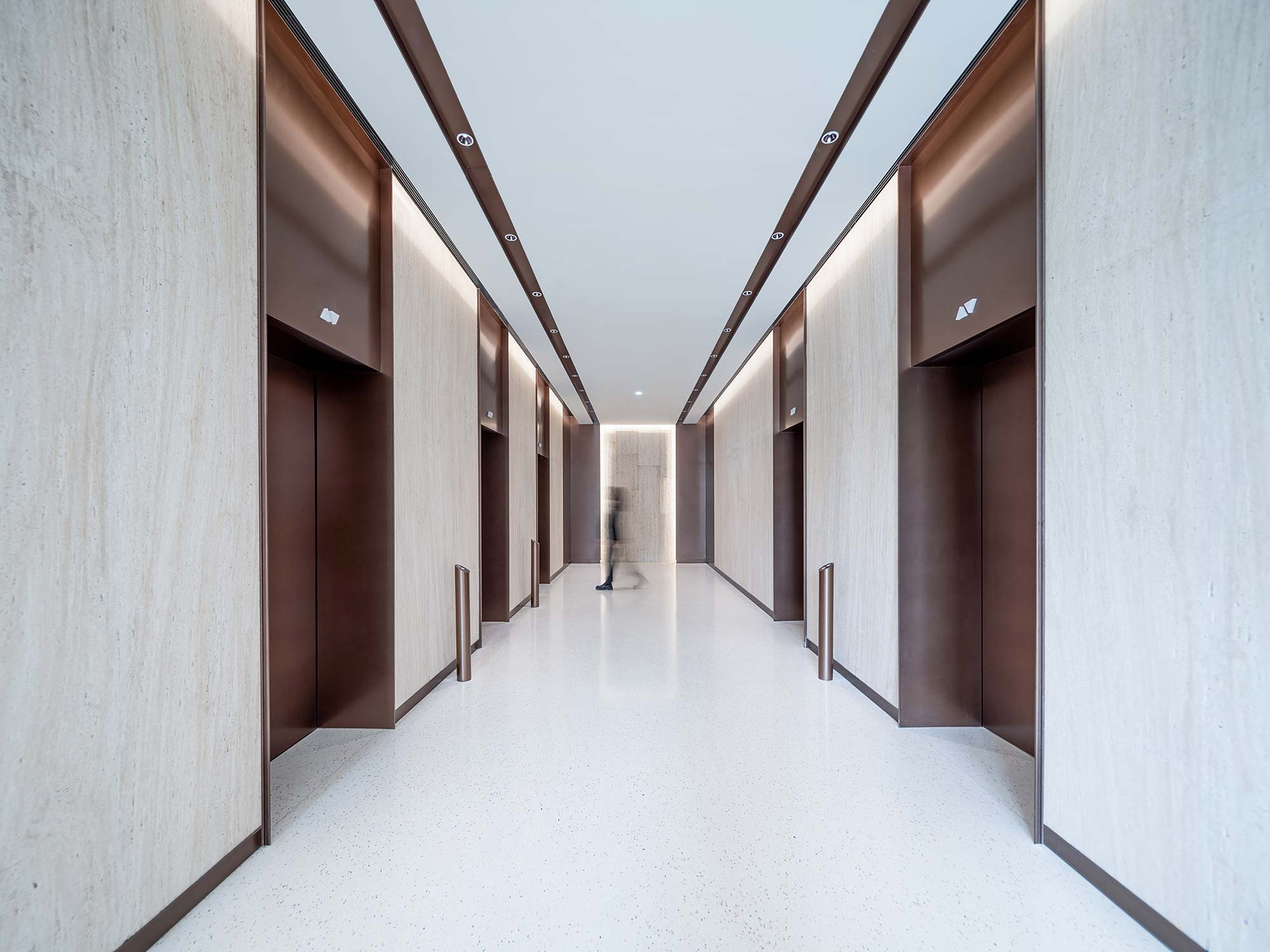 A long hallway with many doors.