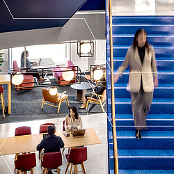 A woman walking in a room.