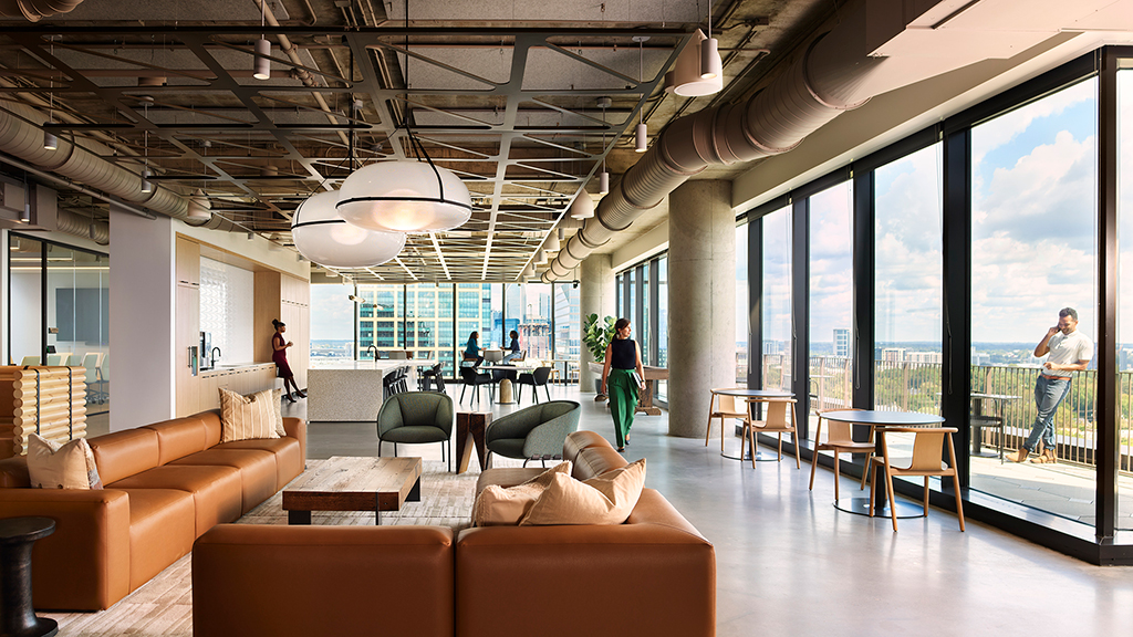 A room with a large window and a group of people in it.